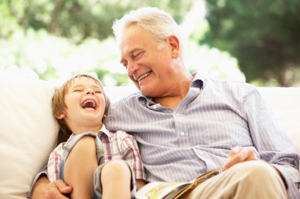 A grandfather and grandson reading together after restful sleep in Salt Lake City.